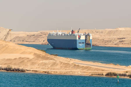 Ismailia, Egypt - November 14, 2019: Vehicles Carrier vessel DIGNITY ACE passing Suez Canal in...