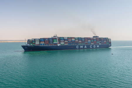 Suez, Egypt - November 14, 2019: Large container vessel ship CMA CGM MEXICO passing Suez Canal in...