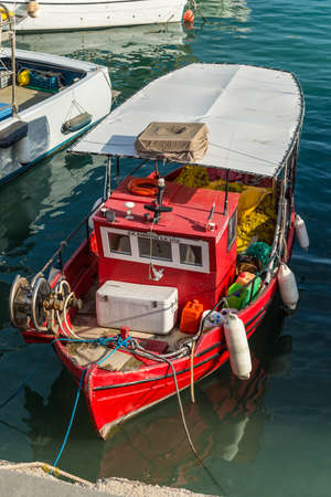 Heraklion, Greece - November 12, 2019: Red wooden fishing boat in port of Heraklion, Crete Island, Greeceのeditorial素材