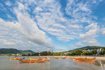 Phuket, Thailand - November 29, 2019: Traditional longtail boats on the shore of Patong beach in Phuket island, Thailand, Andaman sea.のeditorial素材