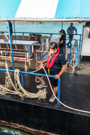 Phuket, Thailand - November 29, 2019: Crew waiting for the boat to dock at the pier in the Patong bay - Cruise Docking in Phuket island, Southern of Thailand, Andaman sea.のeditorial素材