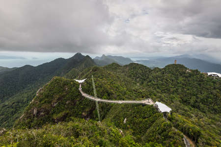 Langkawi, Malaysia - November 30, 2019: Langkawi Sky Bridge on a cloudy day. Adventure holiday. Tourist attraction of Malaysia. Travel concept.のeditorial素材