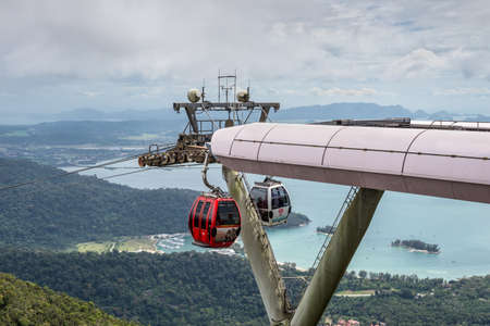 Langkawi, Malaysia - November 30, 2019: View of Cable Car with mountains, sea and tropical forests in the background, Langkawi, Malaysia. Langkawi SkyCab is one of the major attractions in the island.のeditorial素材