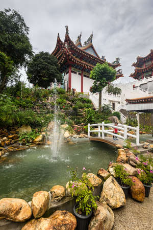 Kuala Lumpur, Malaysia - December 2, 2019: View of the Thean Hou Chinese temple in Kuala Lumpur Malaysia in cloudy weather. The fountain in the foreground.のeditorial素材