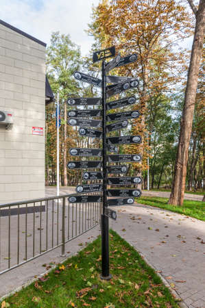 Kyiv, Ukraine - October 11, 2020: Mile marker signpost and arrows with distances to Ukrainian cities near Railway station of the children's railway in Syretsky park, Kyiv, Ukraine, Europe.のeditorial素材