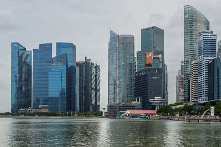 Singapore - December 3, 2019:  Singapore city skyline of business district downtown in cloudy weather.のeditorial素材