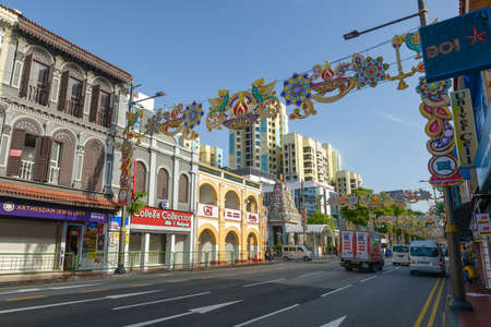 Singapore - December 4, 2019: Street view of Little India at day with Tamil Hindu Temple, shops and...