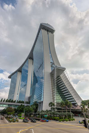 Singapore - December 4, 2019: Street scene in Singapore at sunny day with the Marina Bay Sands Hotel.のeditorial素材