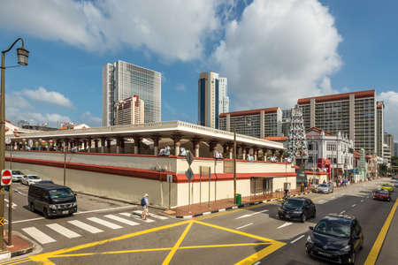 Singapore - December 4, 2019: Street view of Chinatown Singapore at sunny day with Hindu Temple and tourist shops in Singapore's old heritage Chinatown.のeditorial素材