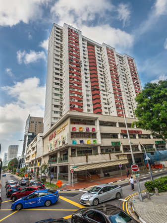 Singapore - December 4, 2019: Street view of Singapore at sunny day with the centre of arts and books Bras Basah Complex, Singapore.のeditorial素材