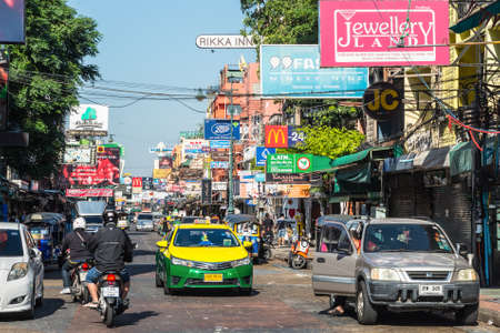 Bangkok, Thailand - December 7, 2019: Famous moto-taxi called tuk-tuk is a landmark of the city and popular transport, Tuk tuk on the street in Bangkok, Thailand.のeditorial素材
