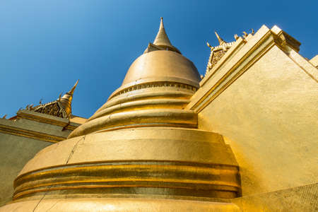 Bangkok, Thailand - December 7, 2019: Gold plated mosaic on stupa, chedi close up, Golden pagoda at Temple of the Emerald Buddha, Grand Palace in Bangkok, Thailand.のeditorial素材