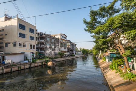 Bangkok, Thailand - December 7, 2019: Street view of Bangkok at day with Tim Mansion Hotel on the Khlong Maha Nak canal in Bangkok, Thailand.のeditorial素材