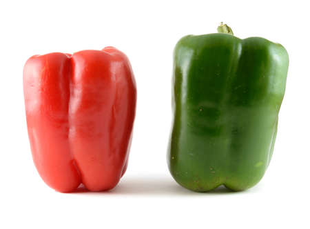A red and green peppers standing up.の写真素材