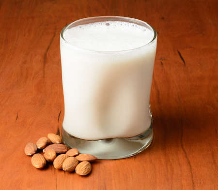 A glass of almond milk on a tableの写真素材