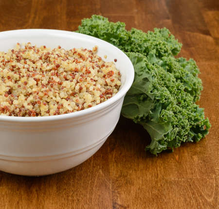 A bowl of quinoa with fresh kale.の写真素材