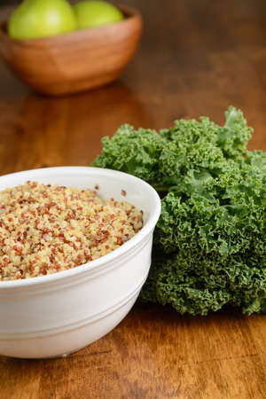 A bowl of quinoa with fresh kale.の写真素材