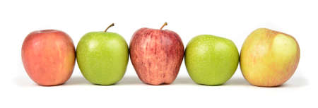 A variety of apples in a row.の写真素材