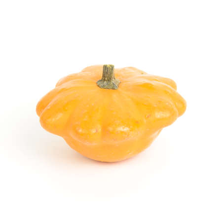 An orange gourd isolated on whiteの写真素材