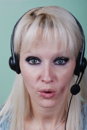 Portrait of young woman with headsetの写真素材