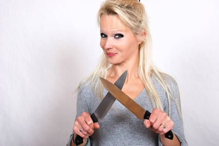 Woman with knifeの写真素材