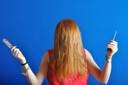 Portrait of a teen having fun with her hairの写真素材