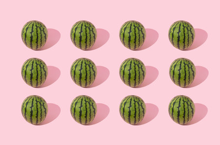 Watermelon pattern on pastel pink background. Summer trendy fruit concept.