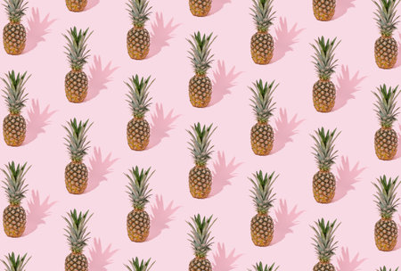 Pineapple made on pastel pink background. Minimal fruit tropical concept. Trendy summer style. From top view.の写真素材