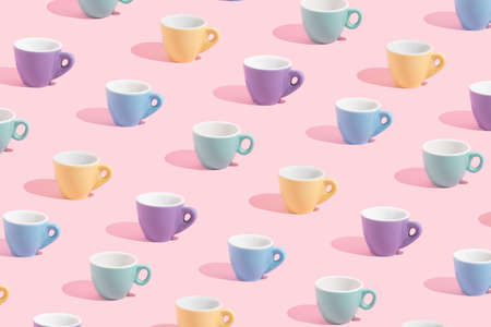 Coffee cup on pastel pink background. Colorful creative pattern concept. Trendy summer pastel color.