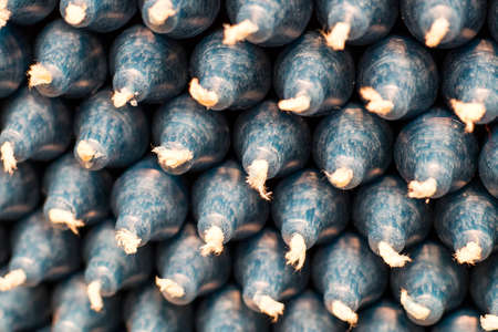 Colorful stick candles with blue tonality, arranged in shelves and sorted by color in a candle shopの写真素材