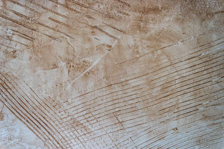 Concrete material yellow colored wall texture with scratches.の写真素材