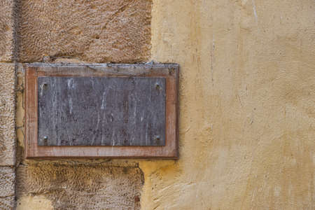 Old vintage metal frame on the concrete wall.の写真素材