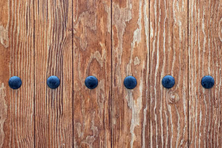Brown colored wooden table texture with metallic parts