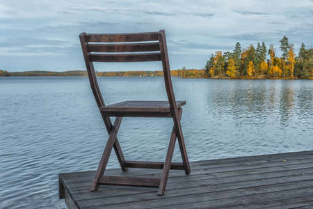 Pier with bench, place for recreation and fishing.の写真素材