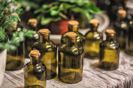 Composition market in Sweden. Old vintage green coloured bottles on the wooden table.の写真素材