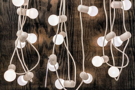 Christmas style decorated wooden wall with set of lights and bulbs