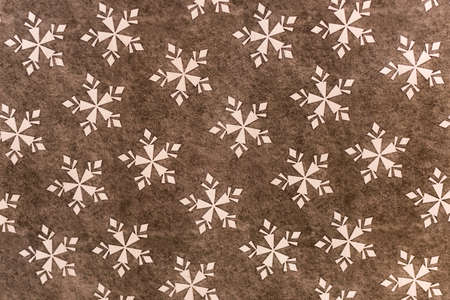 Christmas styled texture ornament with red and white snowflakesの写真素材