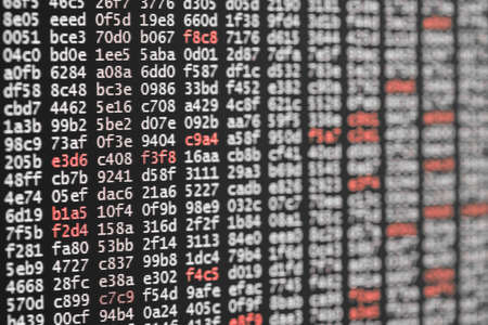 Abstract background texture of code with white and red digitsの写真素材