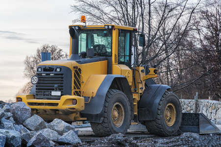 Quarry aggregate with heavy duty machinery. Construction industry.