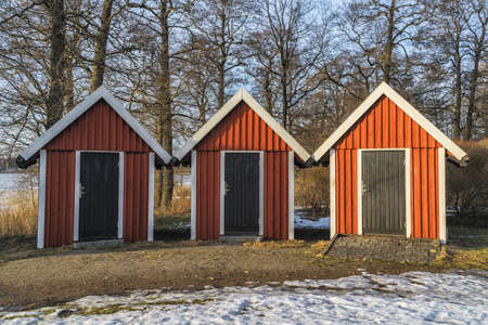 Picture of three small traditional wooden storage houses in Swedenの写真素材