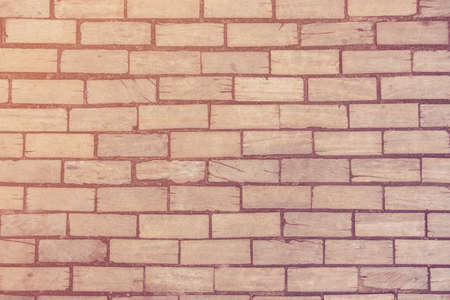 Wooden bricks shaped like concrete material wall, texture with scratches, tonedの写真素材