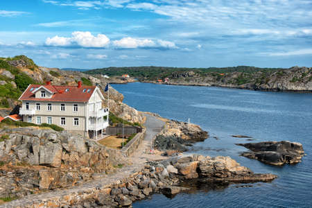 Picture of sea overview with boat on the water and house