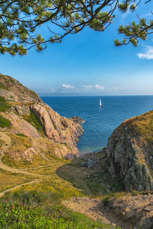 Picture of sea overview with boat on the water and house.の写真素材