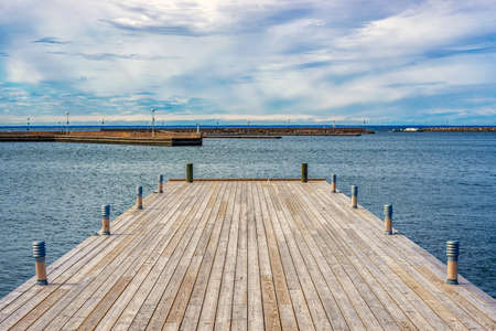 Picture of wooden pier with beatiful blue sky at the background