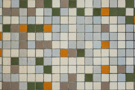 brownish mozaic tiles in a bathroom pattern with brown, white , yellow and green small tilesの写真素材