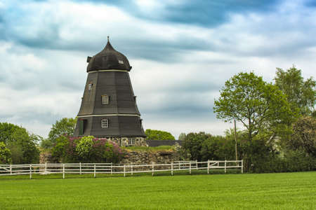 Old windmill converted to living house or apartments in Swedenの写真素材