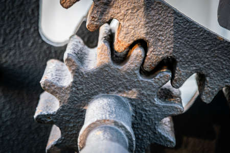 A gear wheel or pinion is a basic part of a gear train in the form of a disc with teeth on a cylindrical or conical surface meshing with the teeth of another gearの写真素材