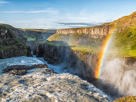 Imageo of Gullfoss wild waterfall, strong running water and rainbow, Icelandの写真素材