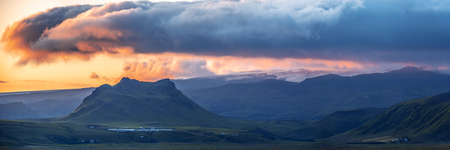 Panoramic Image of Gorgeous Colorful sunset over the mountain landscapes and waterfalls. Iceland.の写真素材