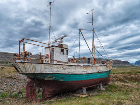 Image of Icelandic fishing boat used as a vehicle for finding fish parket on the beachの写真素材